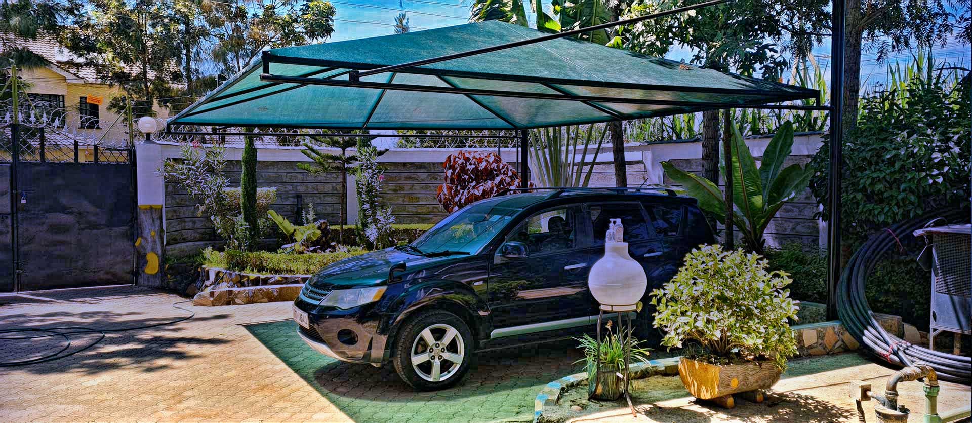 CARPORT-PARKING SHADE-WATERPROOF CAR SHADE-CAR WASH SHADE-VEHICLE PARKING SHADES FOR COMMERCIAL AND RESIDENTIAL USE-PARKING SHADE CANOPY-SHADENET PARKING COVER-BENEFITS OF INSTALLING PARKING SHADES IN KENYA
